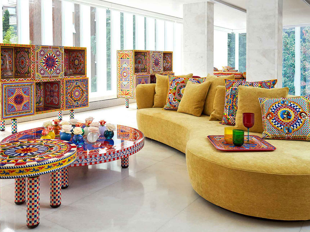 Dolce and Gabbana Casa loveseats, rug, and table in elaborate blue designs